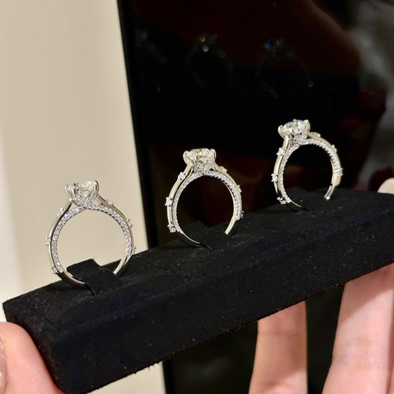 Four-claw moissanite and zircon ring