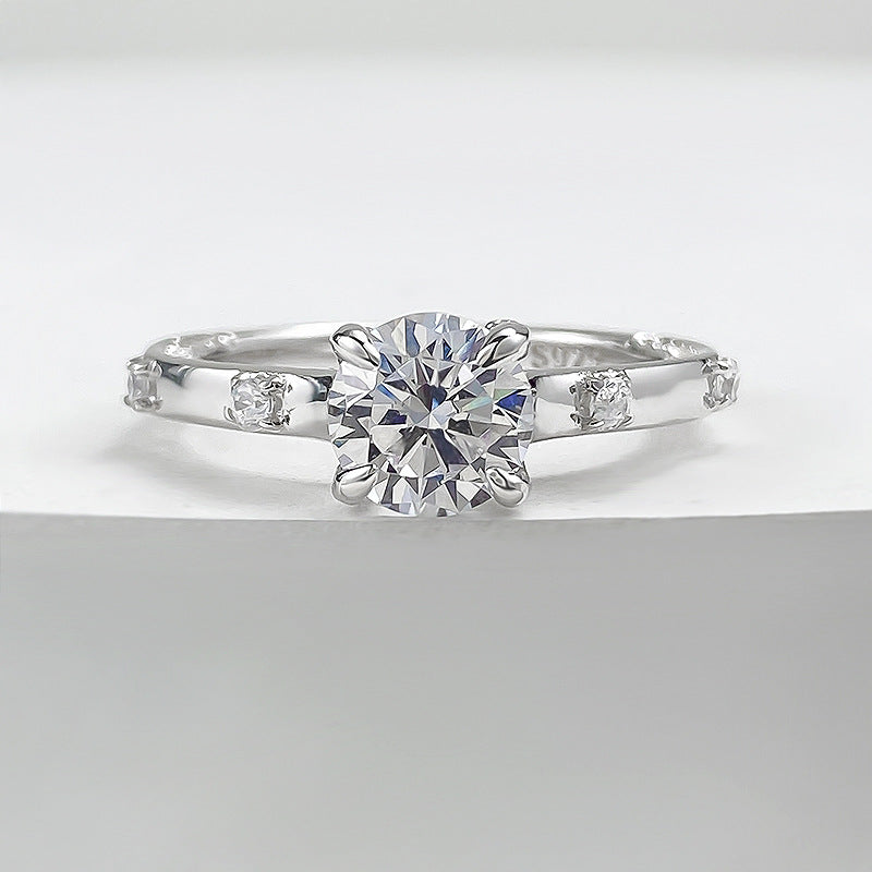 Four-claw moissanite and zircon ring