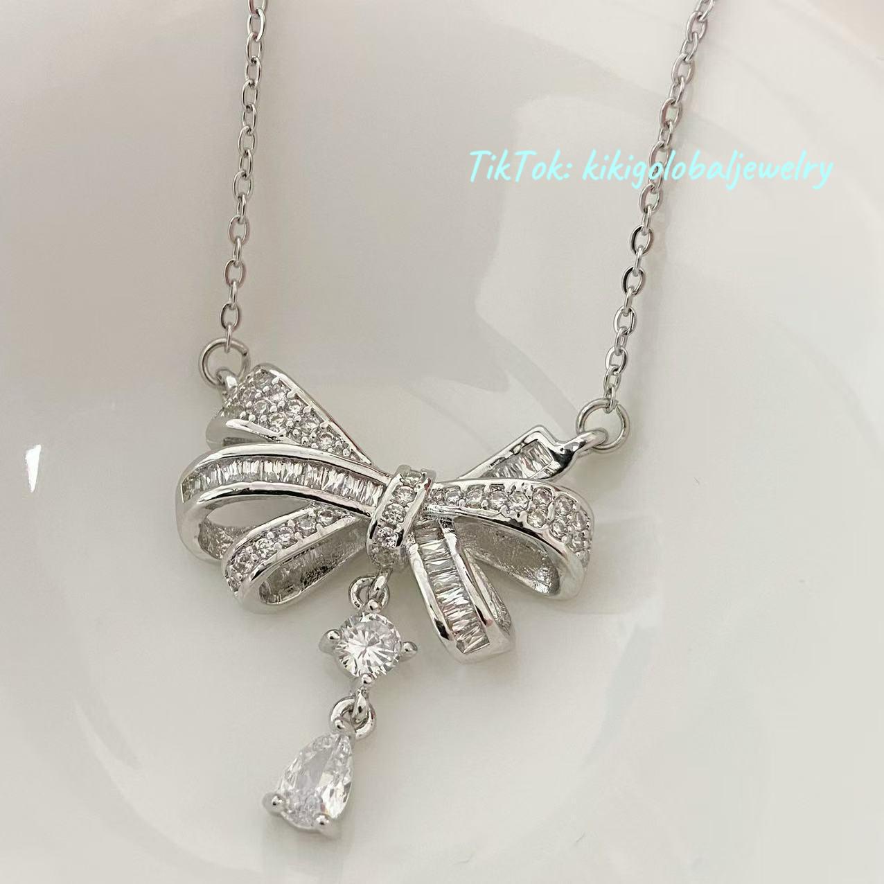 Sterling silver bow drop zircon necklace