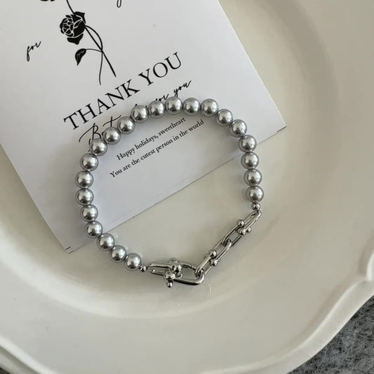 Gray faux pearl and horseshoe clasp bracelet