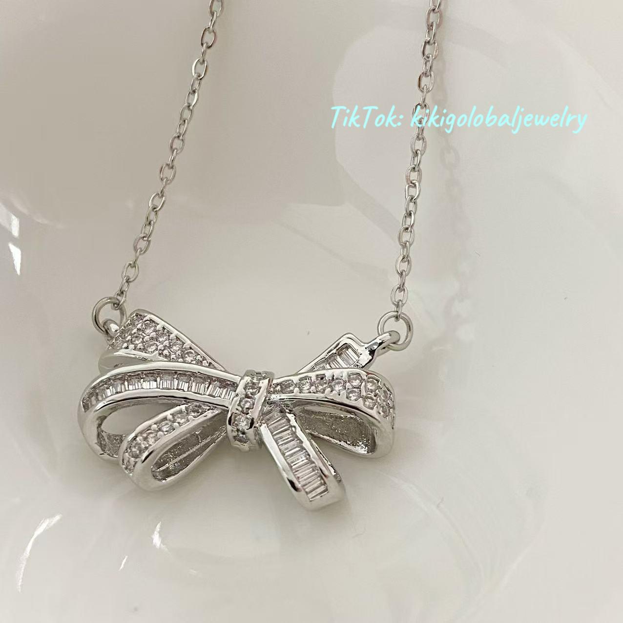 Sterling silver bow drop zircon necklace