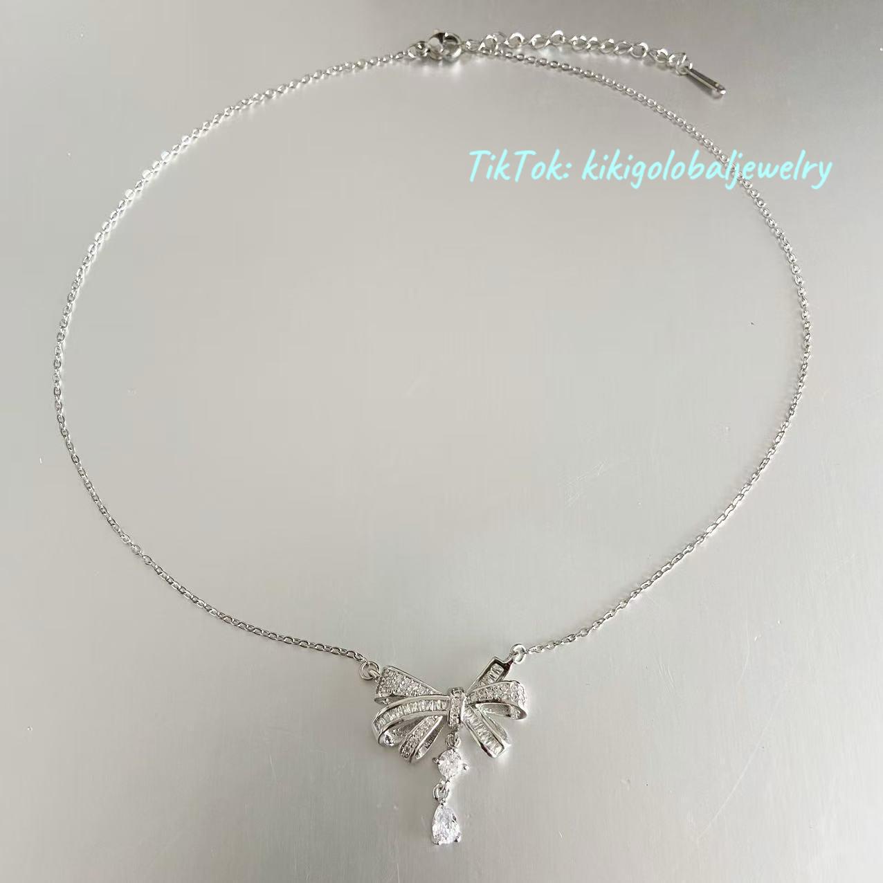 Sterling silver bow drop zircon necklace