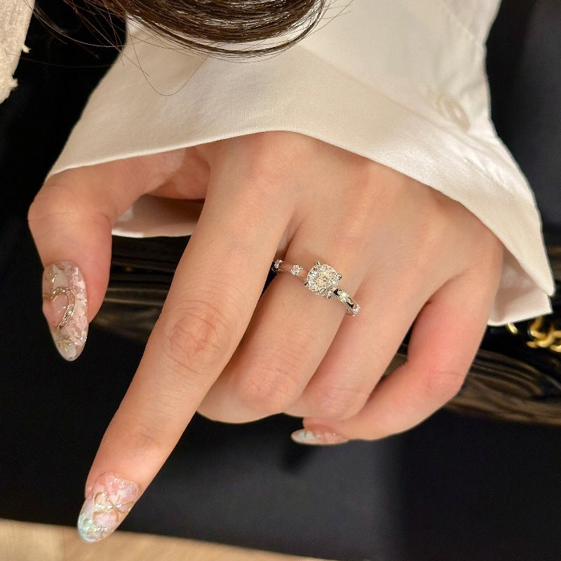 Four-claw moissanite and zircon ring