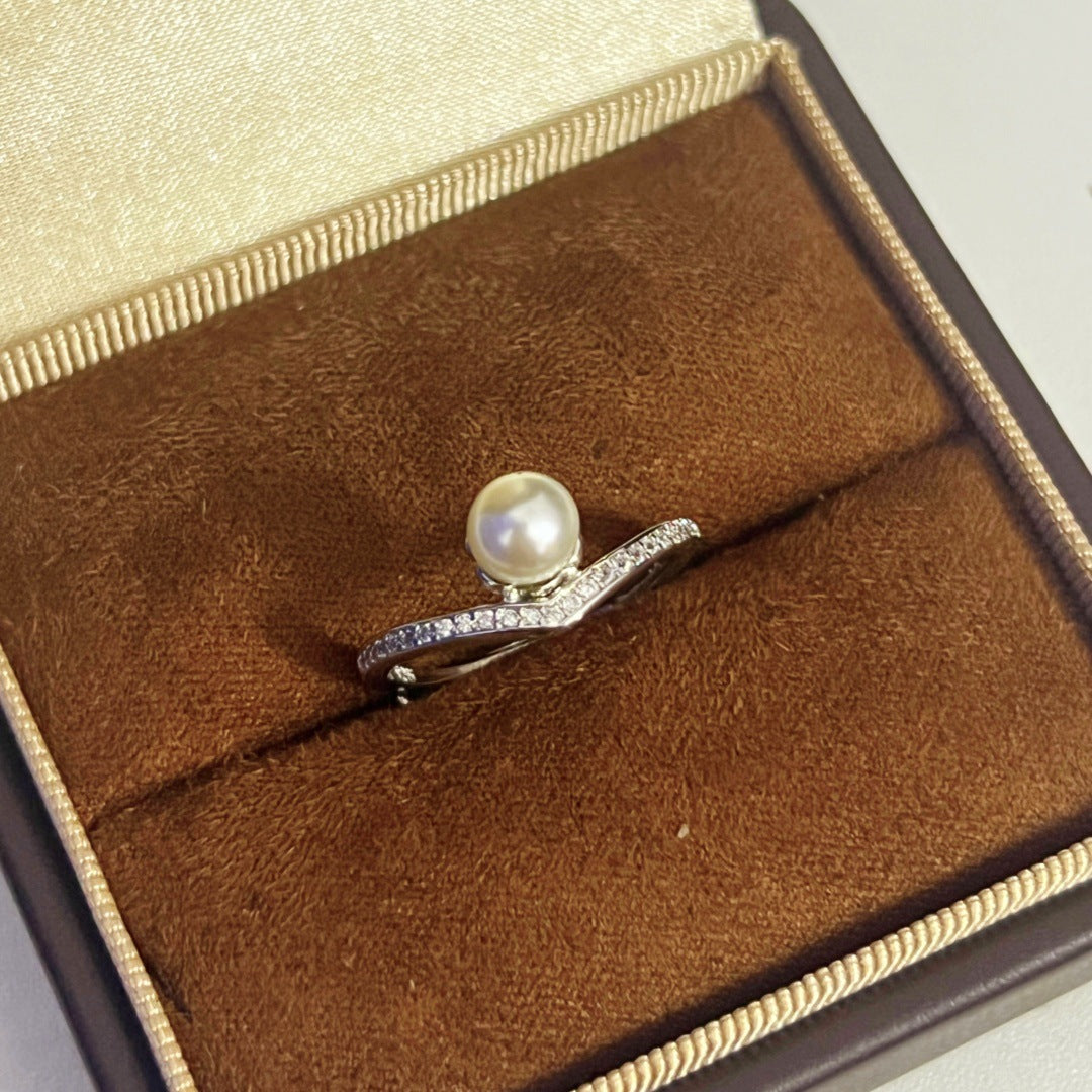 Pearl and zircon open ring